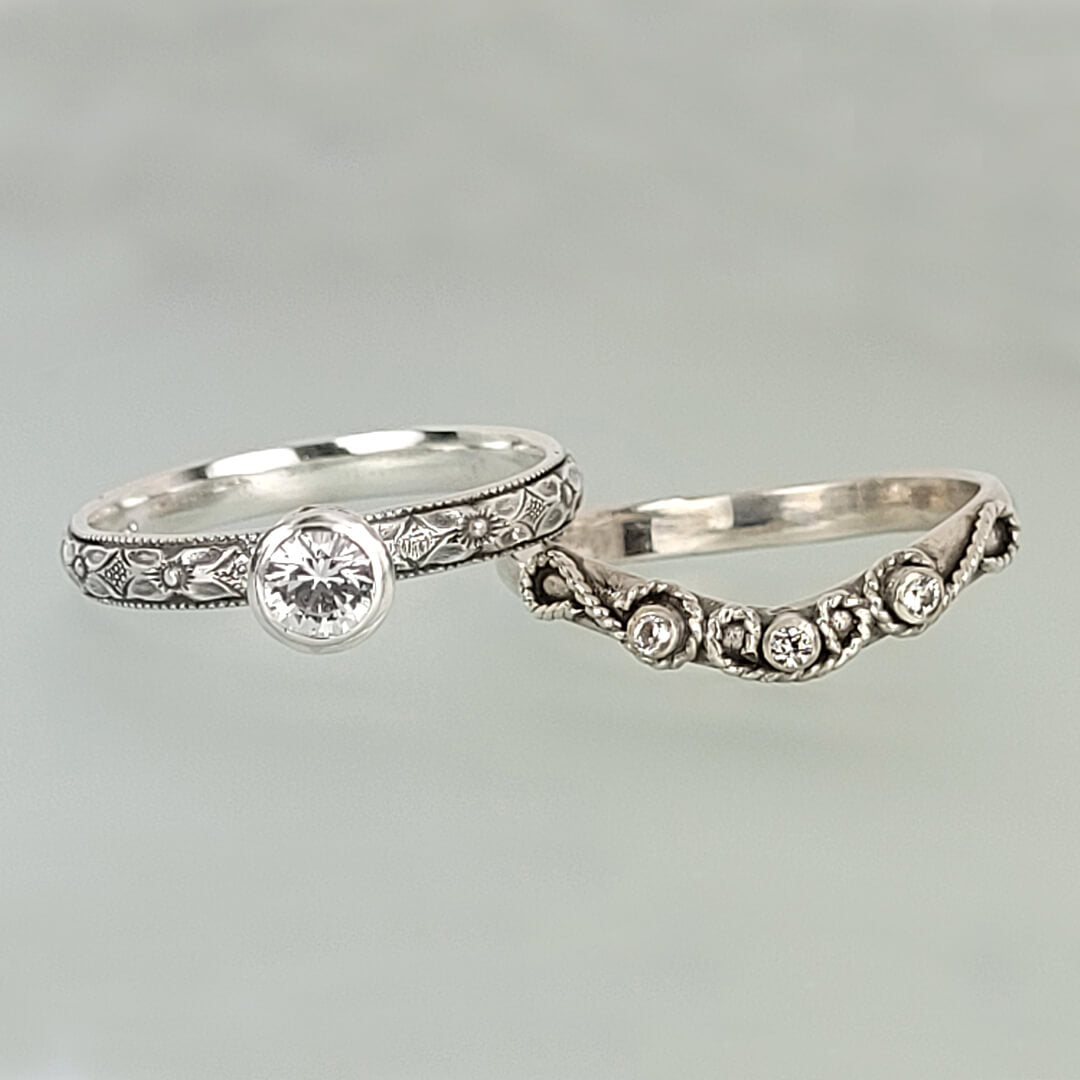 Vintage style white sapphire engagement ring and white sapphire scrollwork curved wedding band set in sterling silver