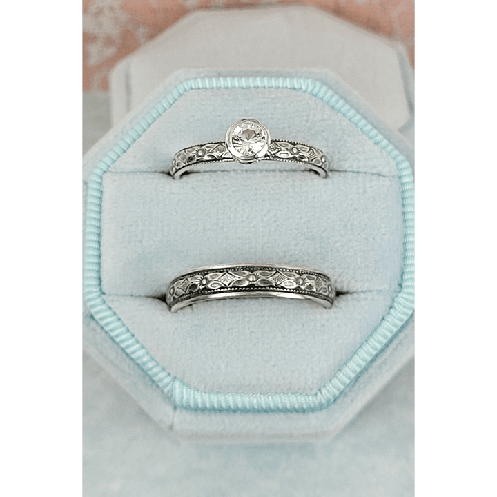 Vintage style white sapphire engagement ring and matching wedding band in sterling silver