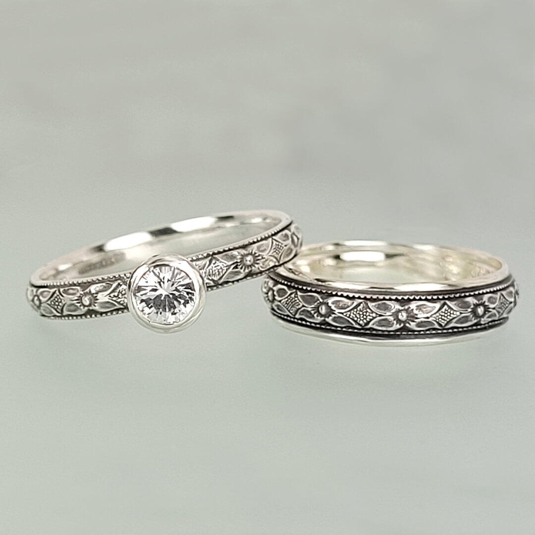 Vintage style white sapphire engagement ring and matching wedding band in sterling silver