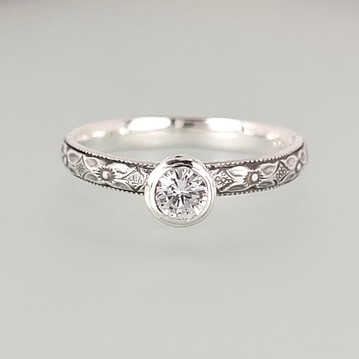 Vintage style white sapphire engagement ring in sterling silver