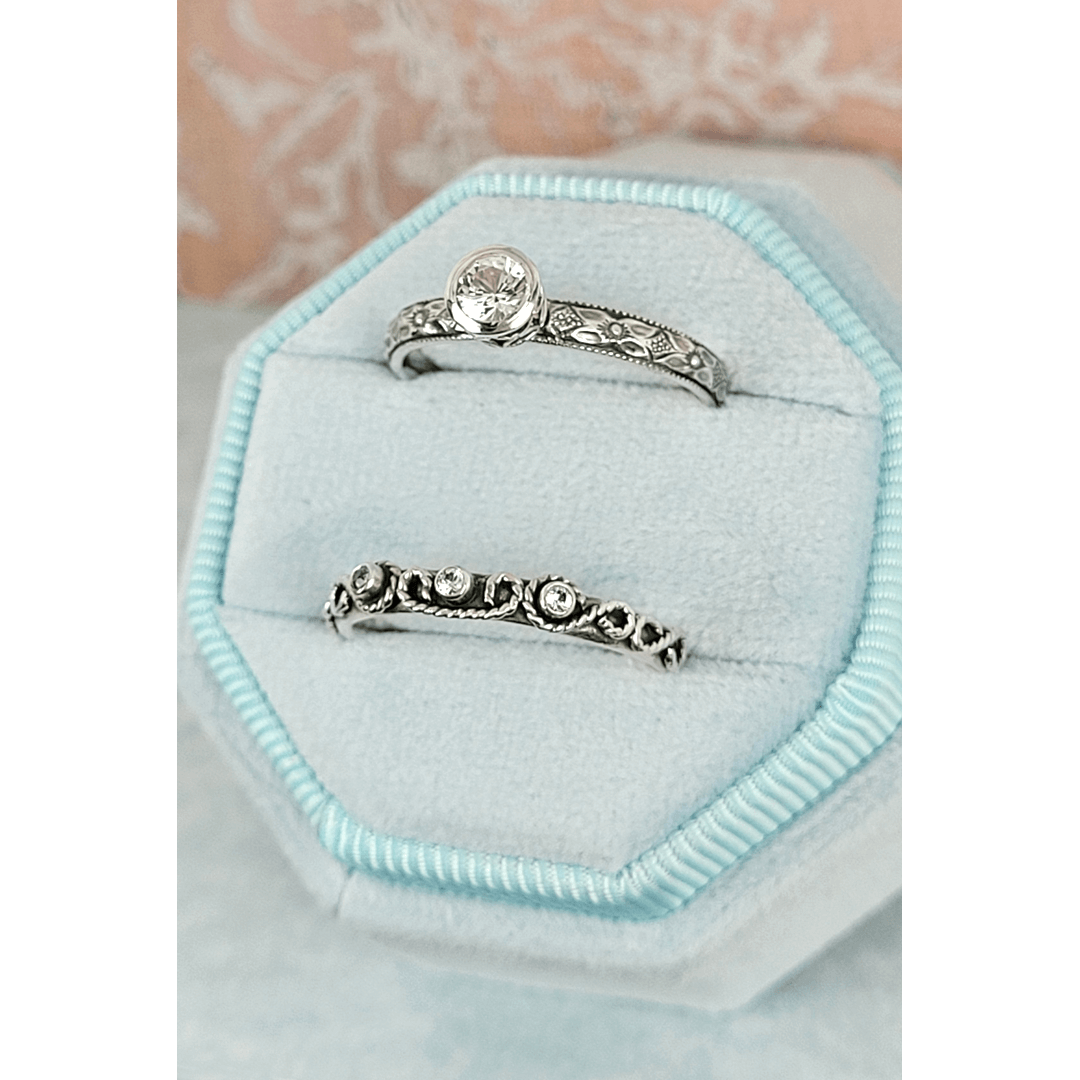 Vintage style white sapphire engagement ring and scrollwork white sapphire wedding band set in sterling silver