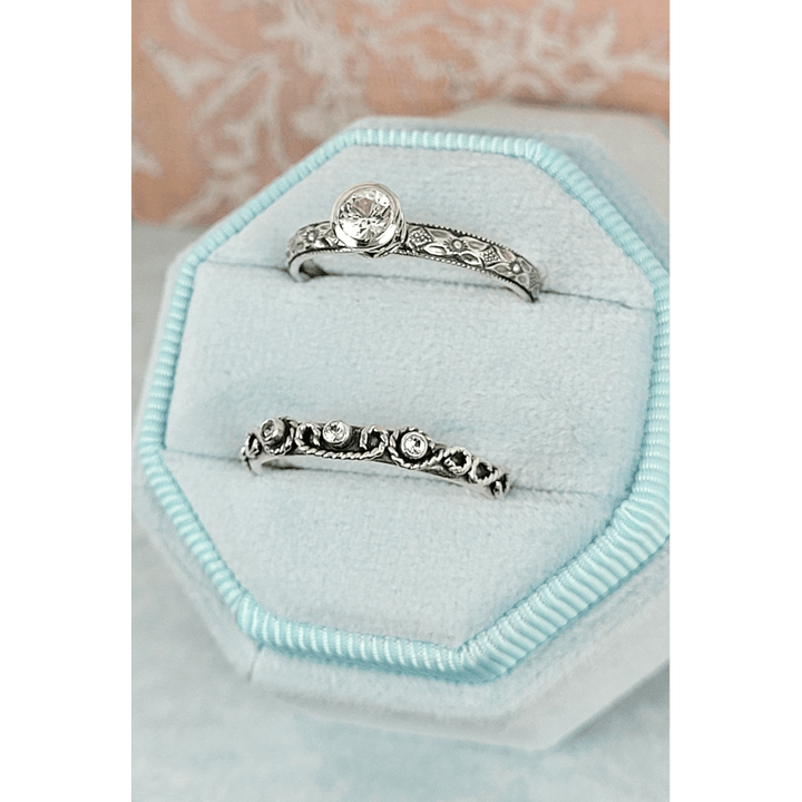 Vintage style white sapphire engagement ring and scrollwork white sapphire wedding band set in sterling silver