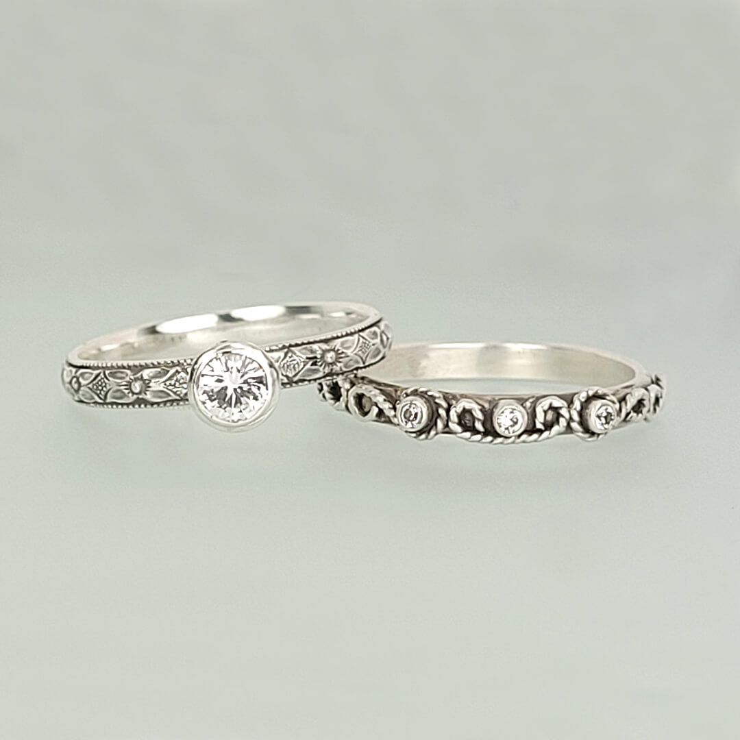 Vintage style white sapphire engagement ring and scrollwork white sapphire wedding band set in sterling silver