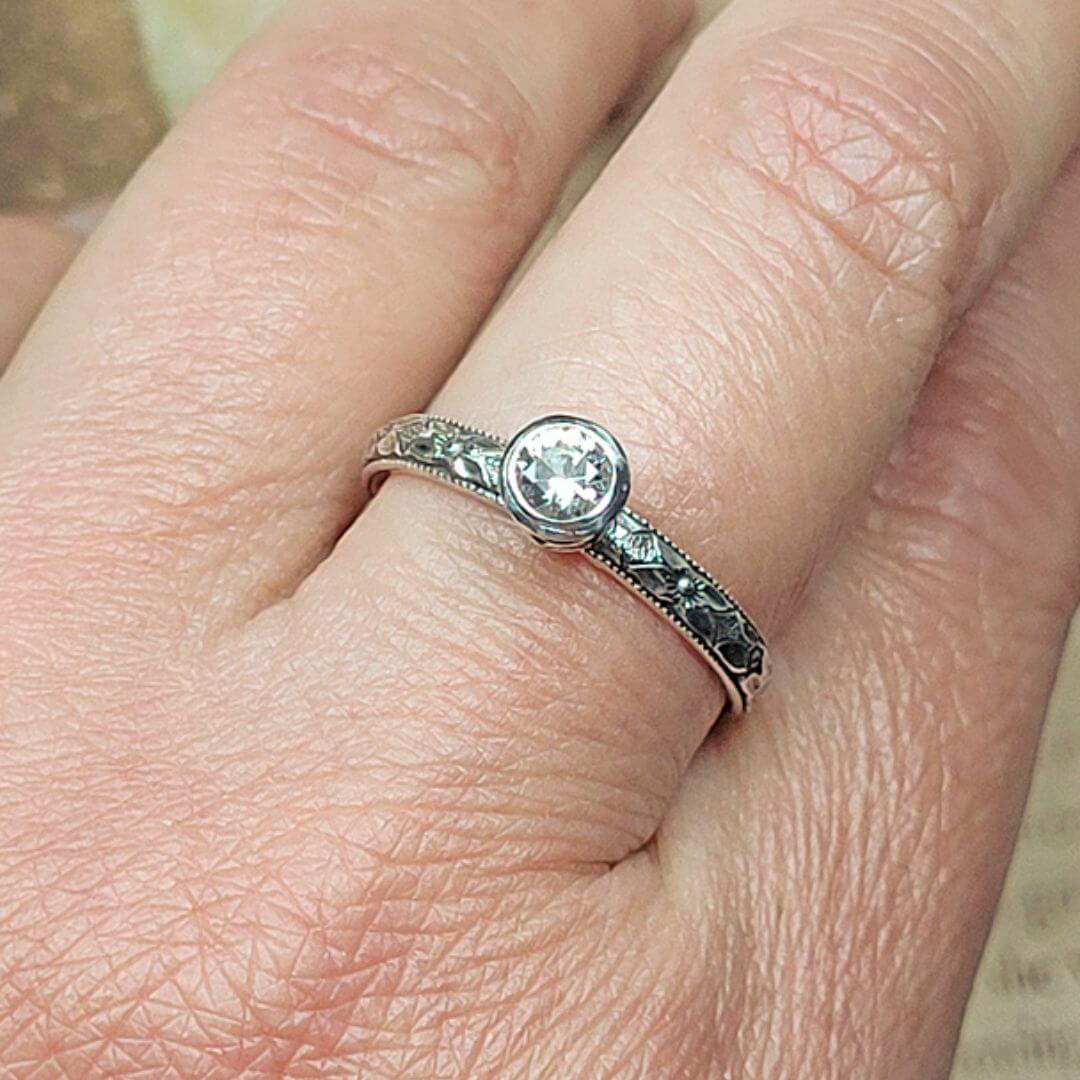 Edwardian Lace White Sapphire Engagement Ring in Sterling Silver on hand