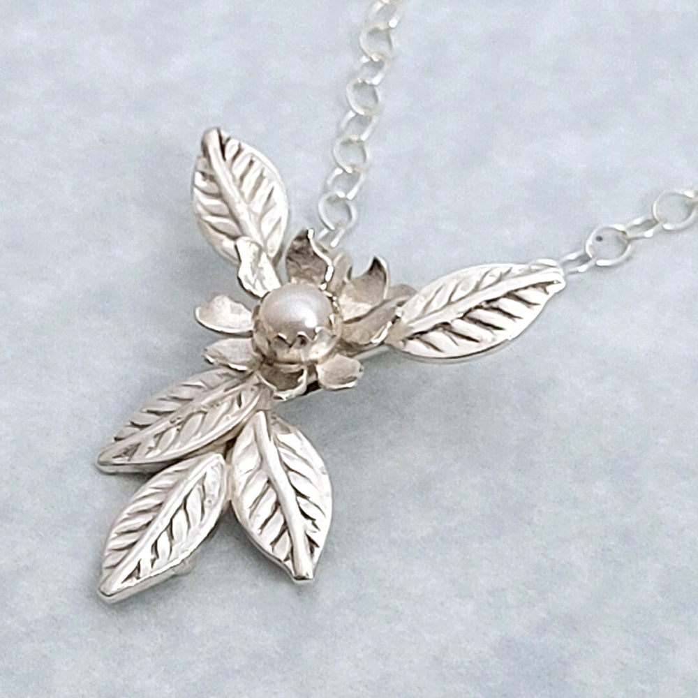 Close-up of Flower Pendant Necklace in Sterling Silver with Freshwater Pearl
