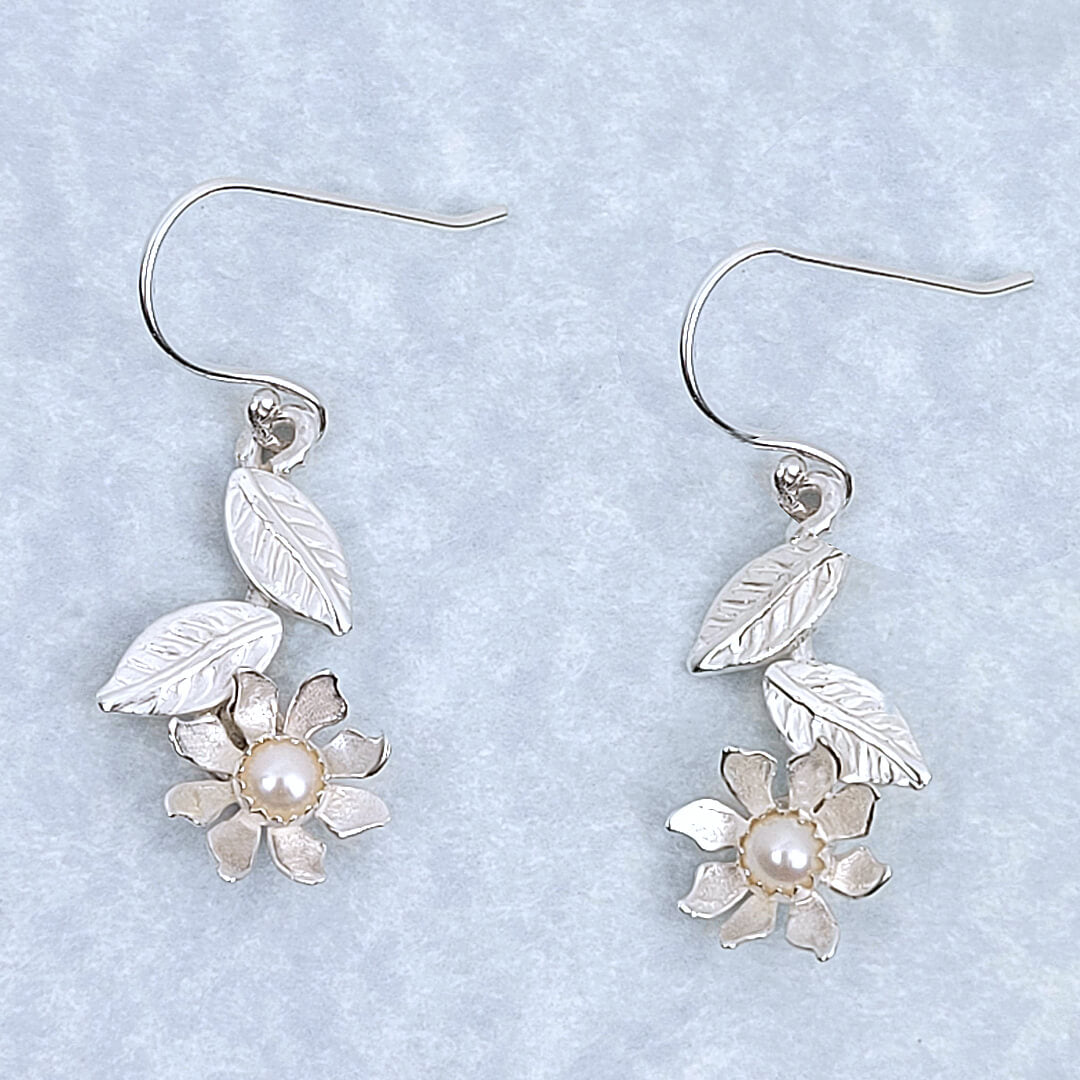 white wildflower dangle earrings in sterling silver set with pearls