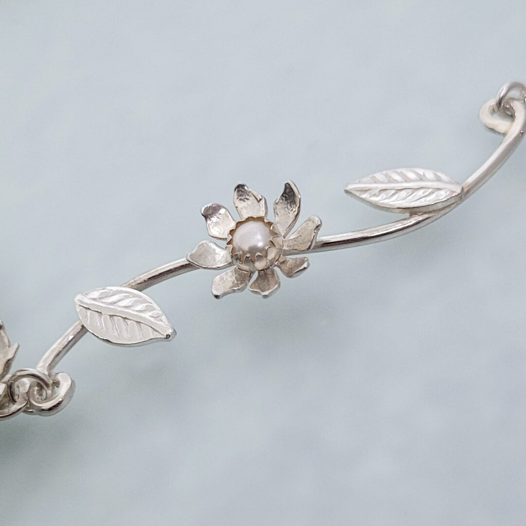 Close-up of Wild Flower Vine Necklace in Sterling Silver with Freshwater Pearls