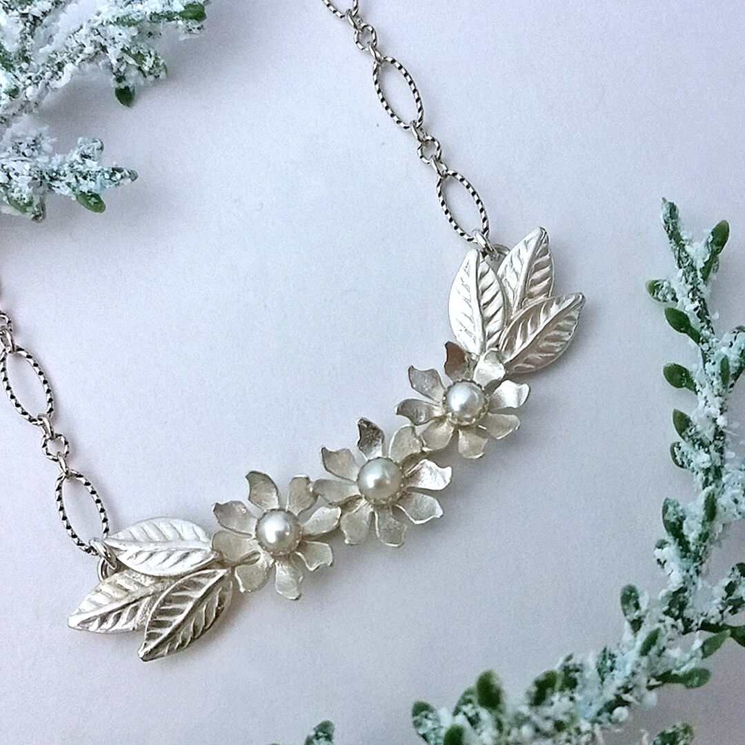 white wildflower wedding necklace in sterling silver set with pearls
