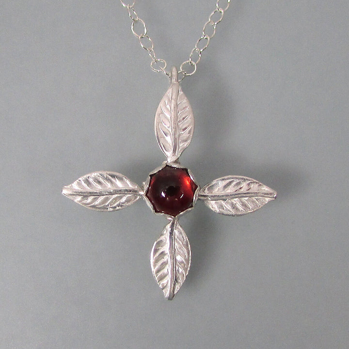 Ixora flower four petal cross necklace in sterling silver with garnet