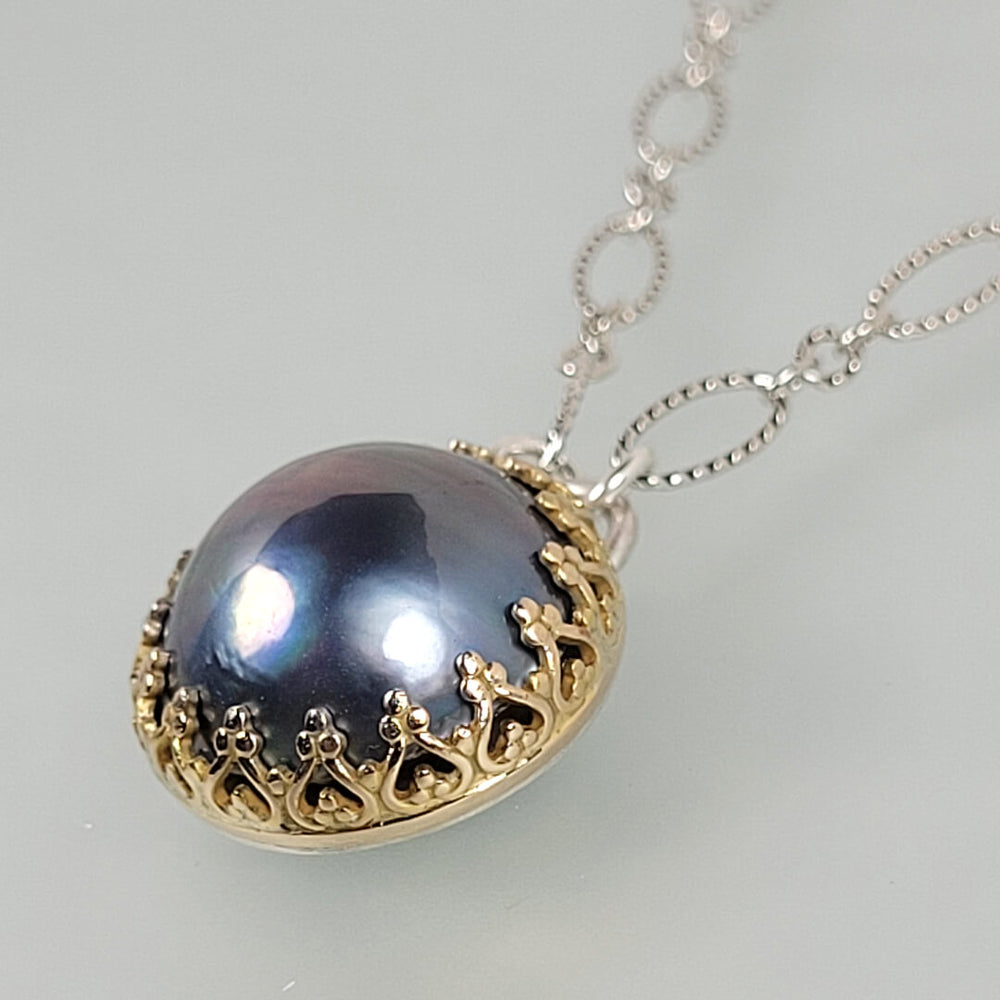 blue mabe pearl necklace in 14kt gold bezel