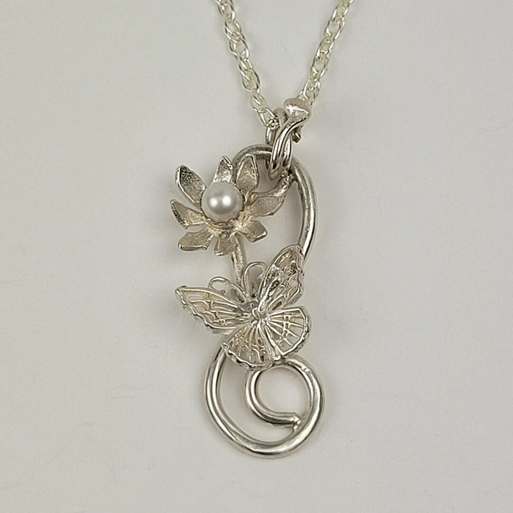 sterling silver butterfly necklace with flower and pearl