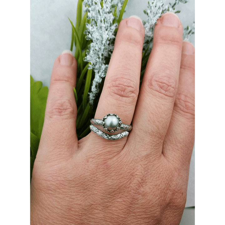 Edwardian style gray pearl engagement ring with matching floral curved wedding band