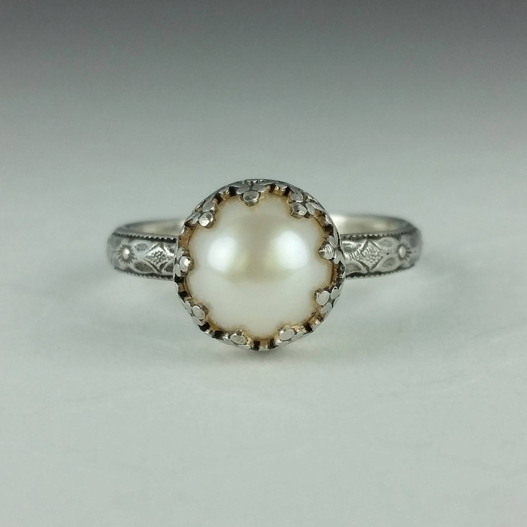Edwardian style pearl engagement ring with floral band