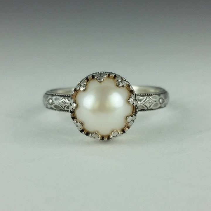 Edwardian style pearl engagement ring with floral band