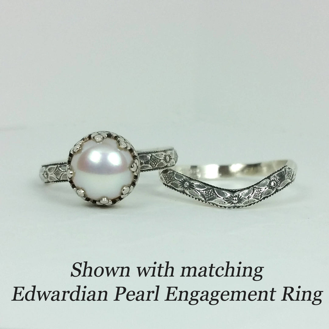 Edwardian style pearl engagement ring with matching floral curved wedding band