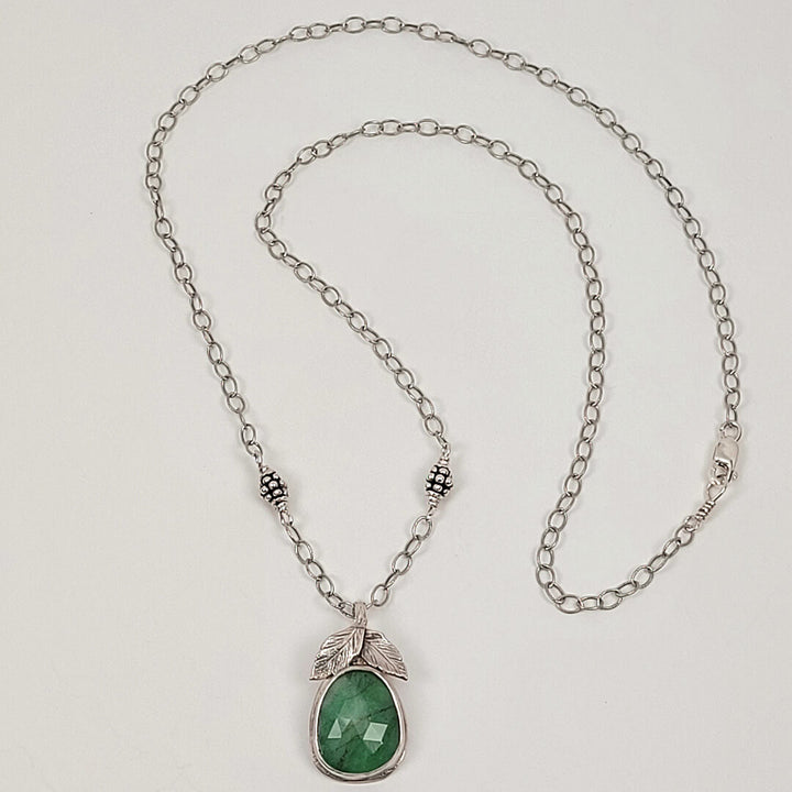 sterling silver faceted raw emerald necklace with leaves