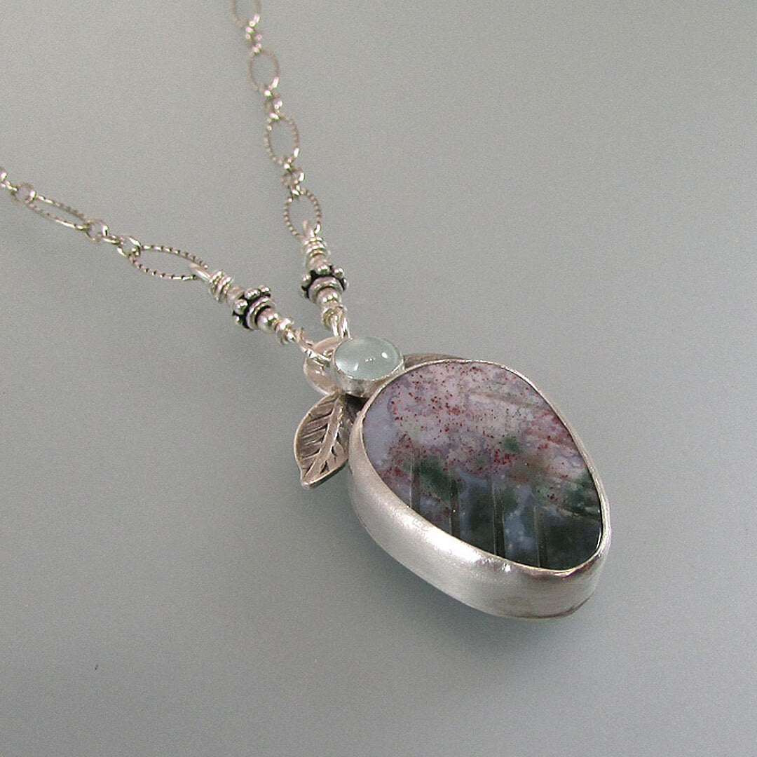 sterling silver leaf necklace with aquamarine and carved agate