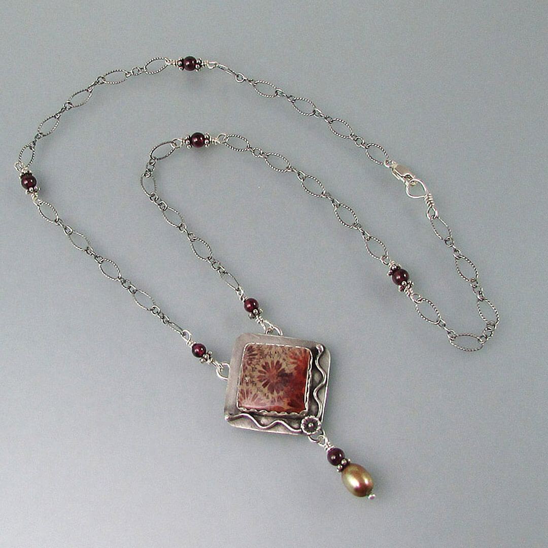 red fossil coral necklace in sterling silver