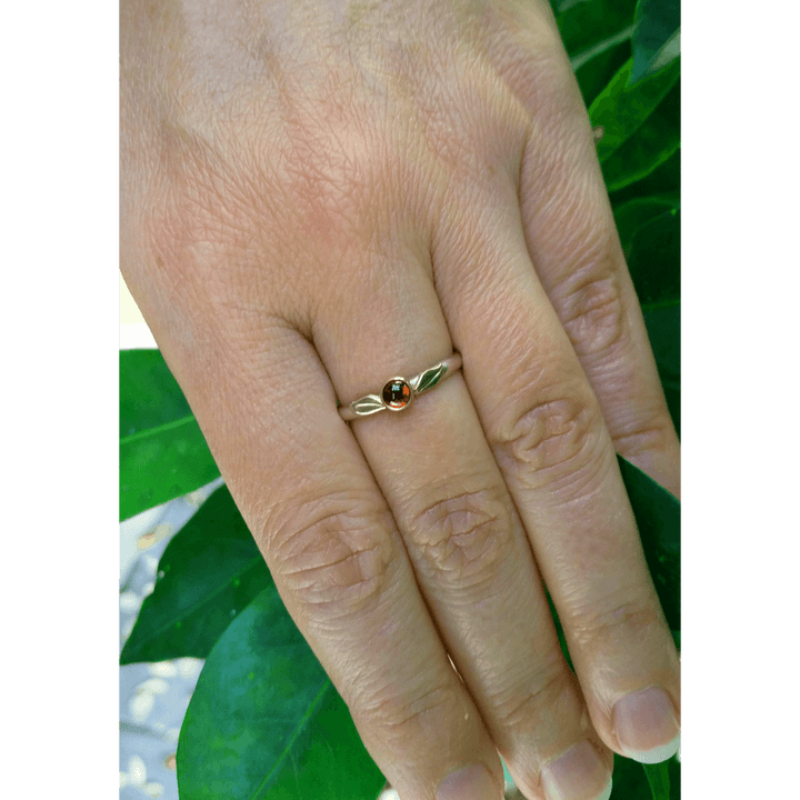 nature-inspired garnet ring with 14kt gold leaves