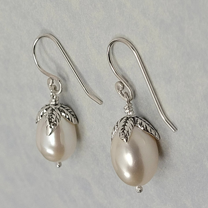 Pearl drop earrings with leaves in sterling silver