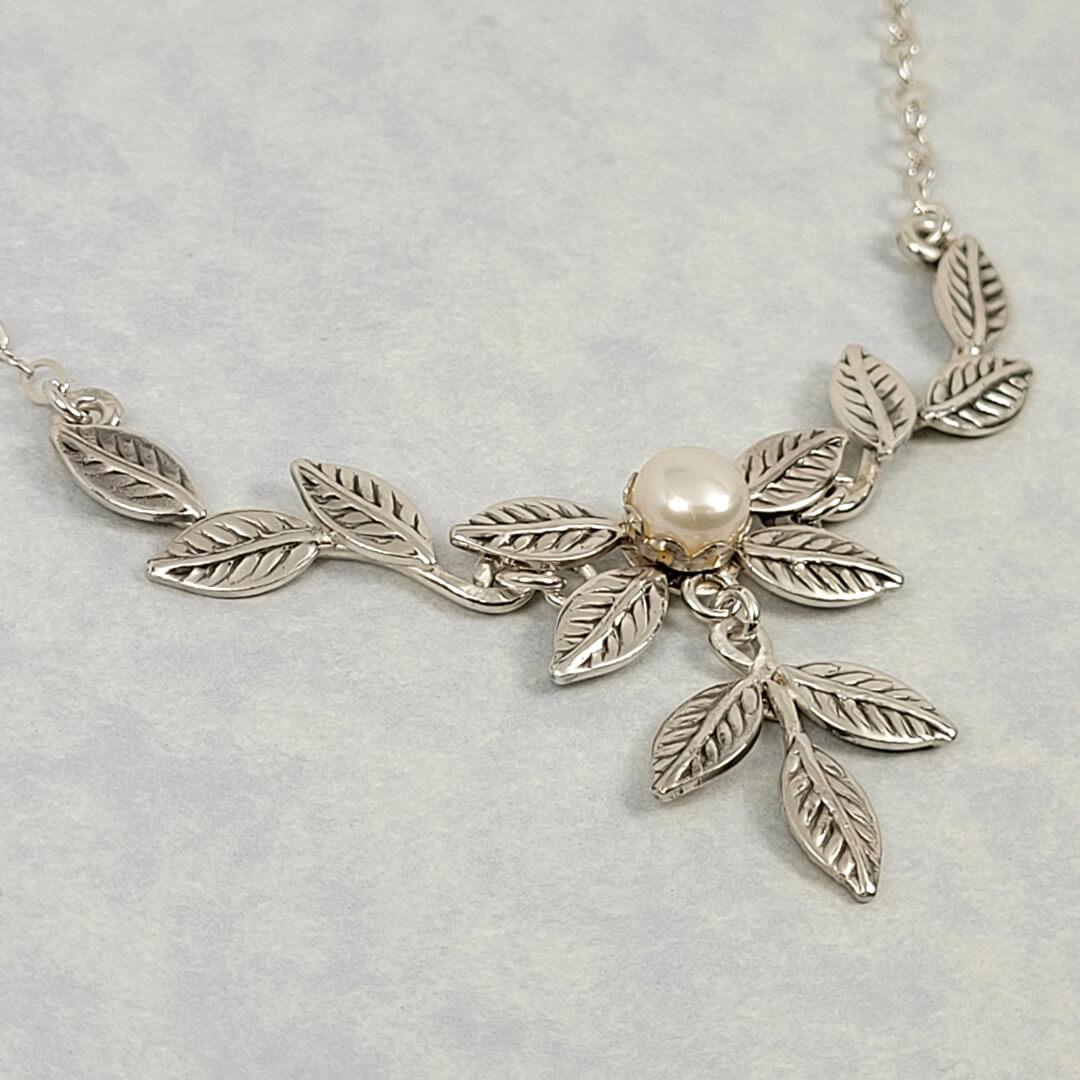 Cascading vine and leaf necklace with pearl