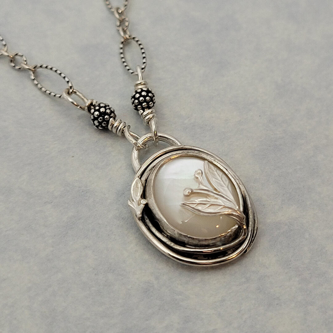 nature-inspired mother of pearl necklace with leaves in sterling silver