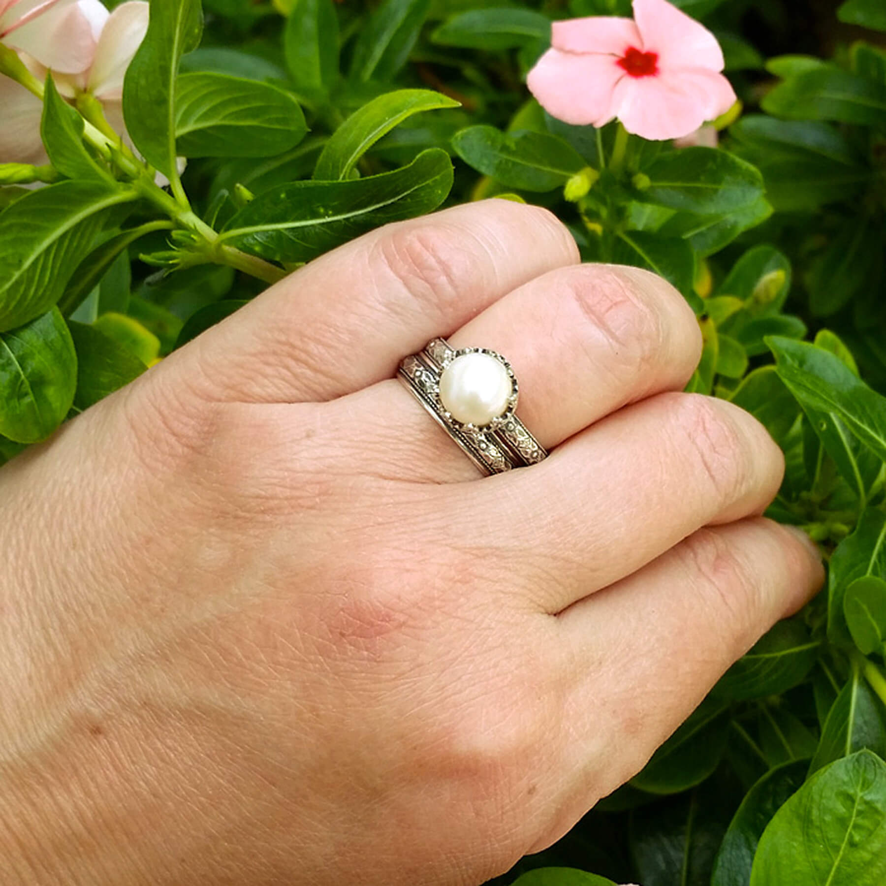 Edwardian Style Pearl Engagement Ring and Floral Wedding Band Set on model 