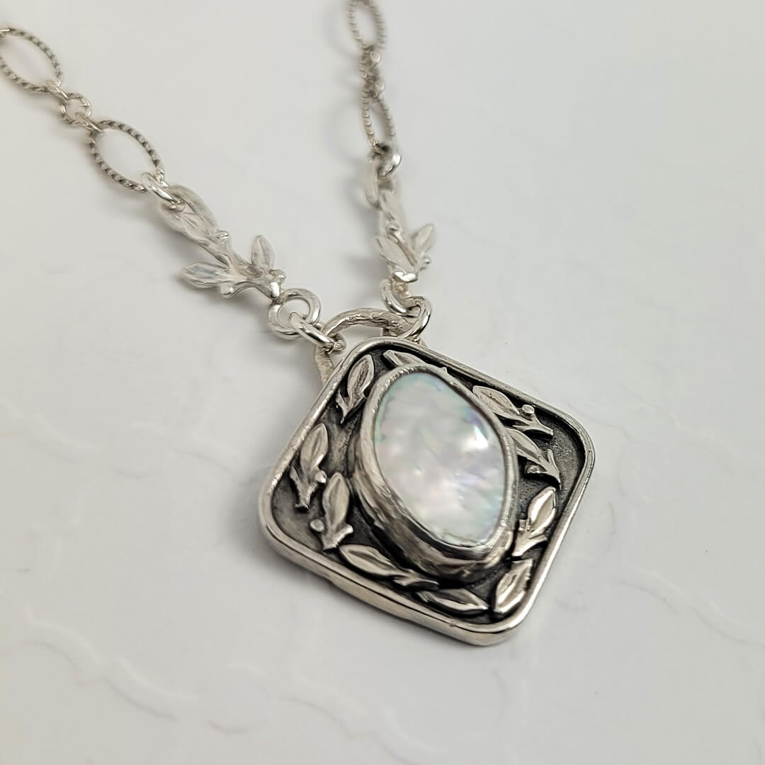 Petal pearl and leaf pendant necklace
