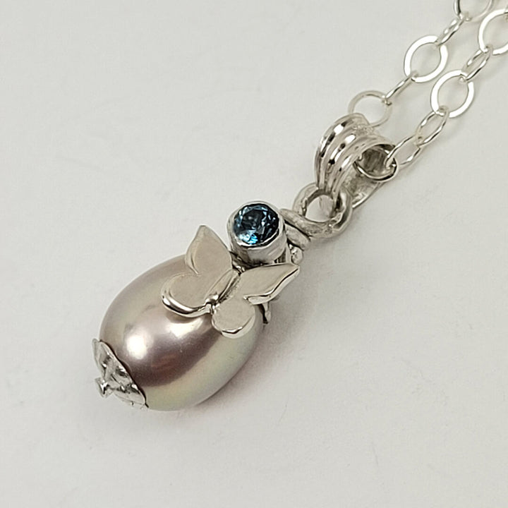 butterfly pearl necklace with London blue topaz in sterling silver