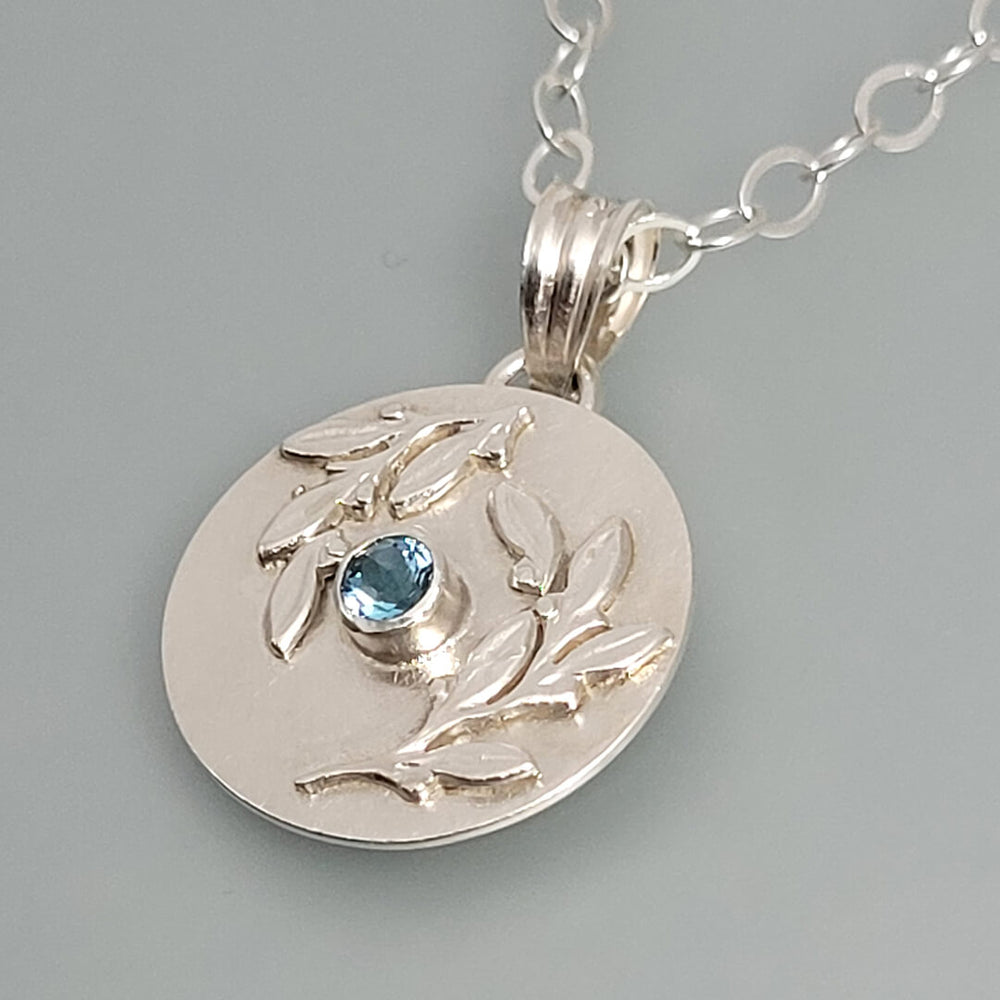 Leaf Bordered Swiss Blue Topaz Necklace in Sterling Silver