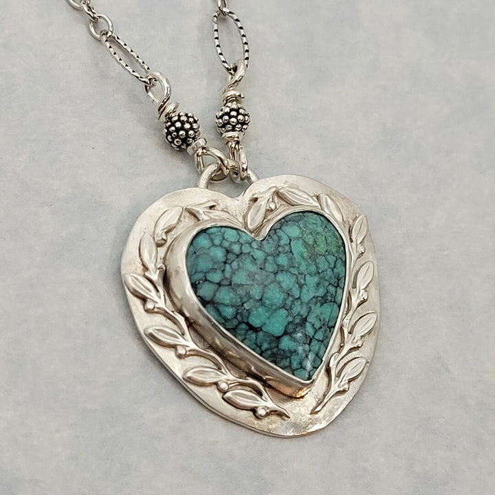 Nature-inspired Turquoise Heart Necklace with Leaves and vines in Sterling Silver