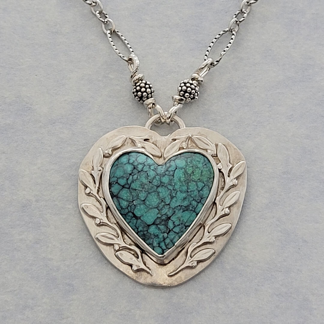 Nature-inspired Turquoise Heart Necklace with Leaves and vines in Sterling Silver