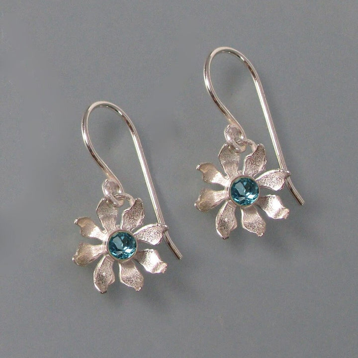 Sterling silver wildflower earrings with faceted Swiss blue topaz
