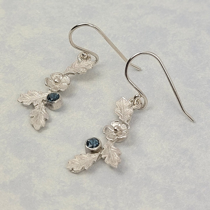 frozen garland flower earrings with oak leaves and London blue topaz